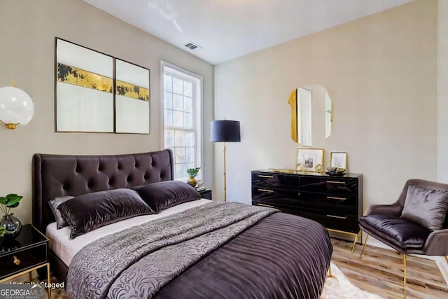 bedroom featuring hardwood / wood-style flooring