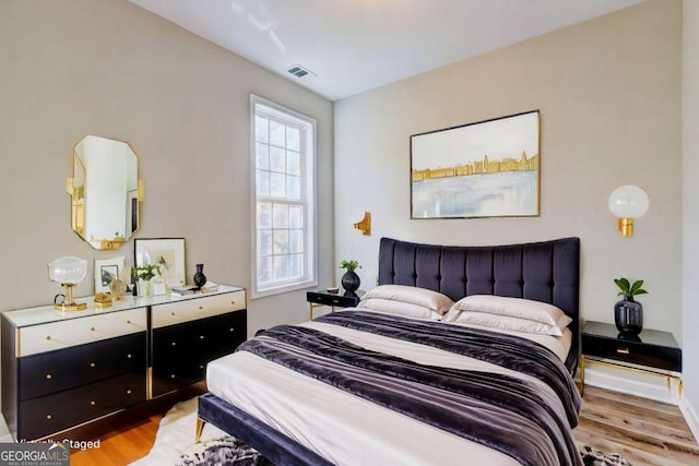 bedroom with light hardwood / wood-style floors