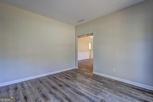 empty room with light hardwood / wood-style flooring