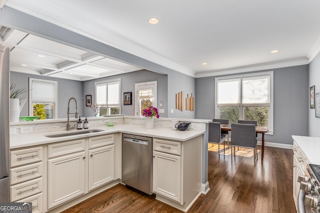 kitchen featuring a sink, light countertops, coffered ceiling, stainless steel appliances, and dark wood-style flooring