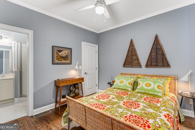 bedroom featuring visible vents, crown molding, baseboards, and wood finished floors