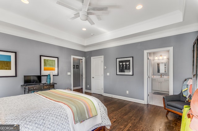 bedroom with baseboards, dark wood finished floors, ornamental molding, recessed lighting, and a raised ceiling