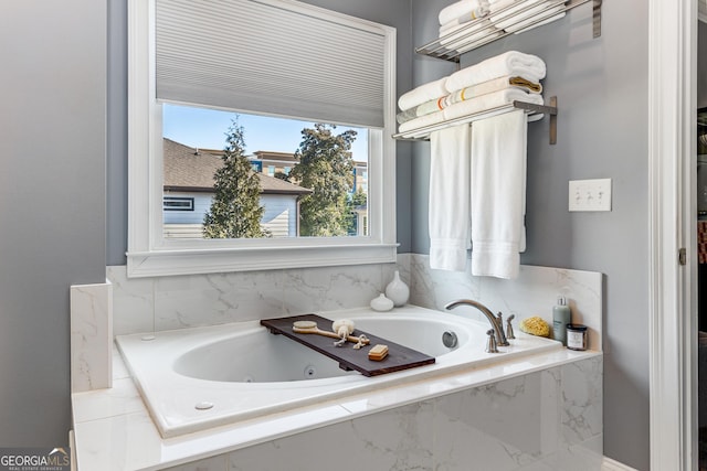 bathroom with a jetted tub