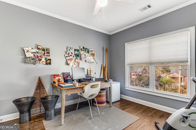 office space featuring visible vents, crown molding, baseboards, and wood finished floors