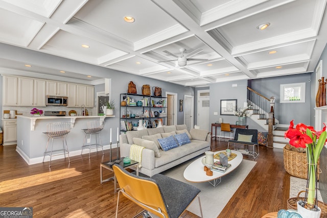 living room featuring stairway, beamed ceiling, recessed lighting, wood finished floors, and coffered ceiling