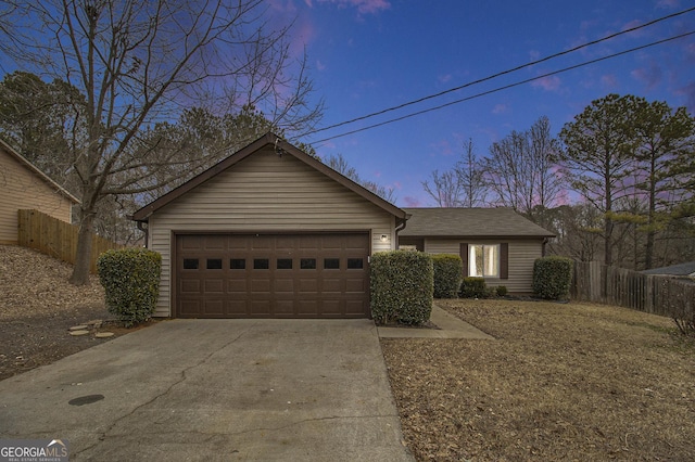 ranch-style house featuring a garage