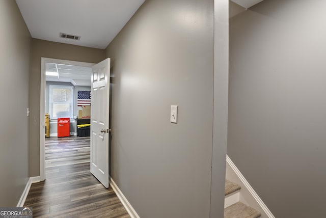 hallway with dark hardwood / wood-style floors