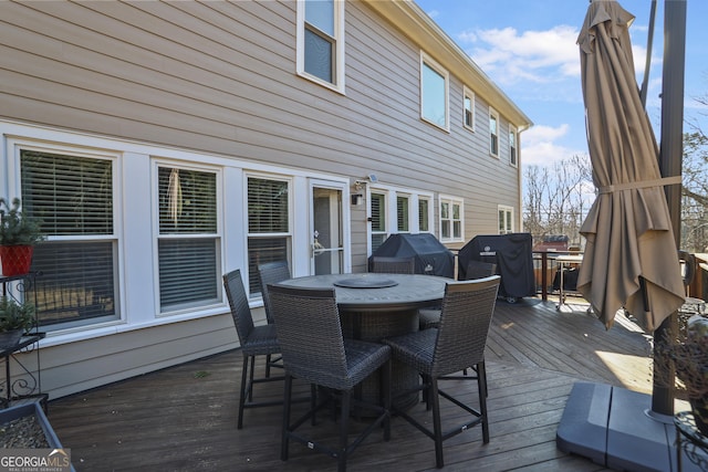 wooden terrace featuring grilling area