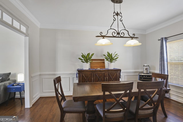 dining space featuring crown molding, a wealth of natural light, and dark hardwood / wood-style flooring