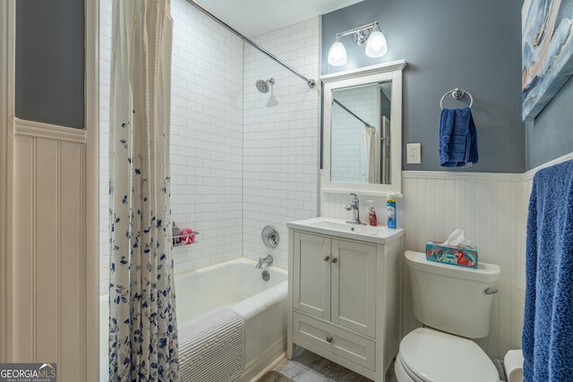 full bathroom featuring vanity, toilet, and shower / bath combination with curtain