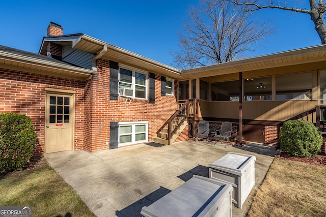 rear view of property featuring a patio area