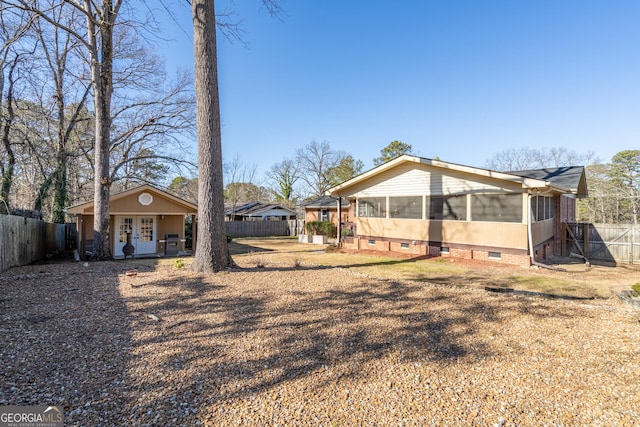 back of house featuring french doors