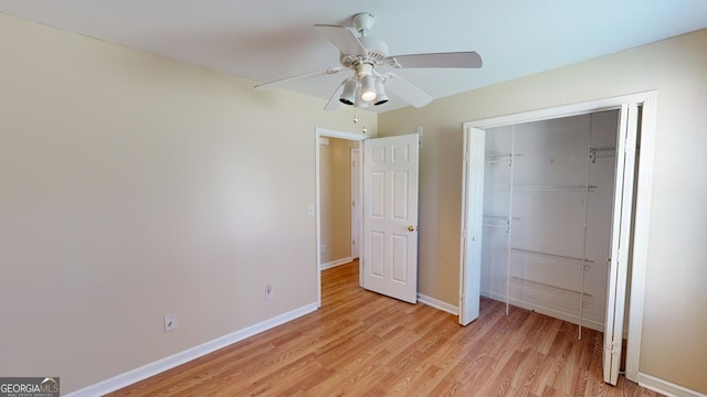 unfurnished bedroom featuring light wood-type flooring, a closet, and ceiling fan