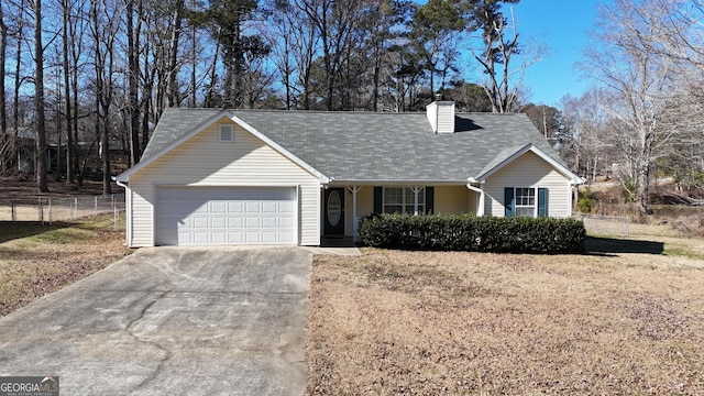 ranch-style house with a garage and a front lawn