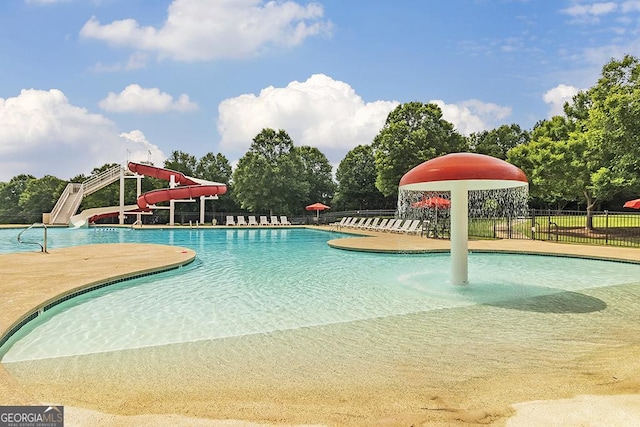 view of pool with a patio and a water slide