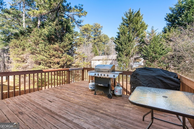 wooden terrace featuring grilling area