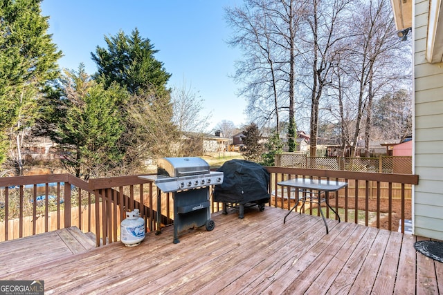 wooden deck featuring grilling area