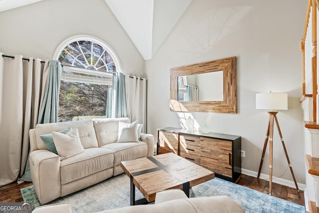 sitting room with vaulted ceiling and dark hardwood / wood-style floors