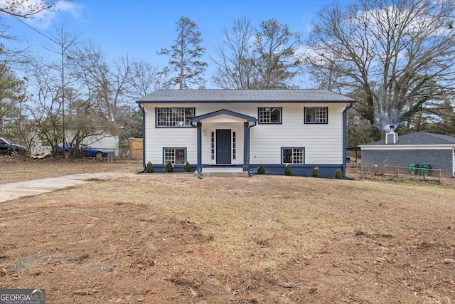 bi-level home with a front yard