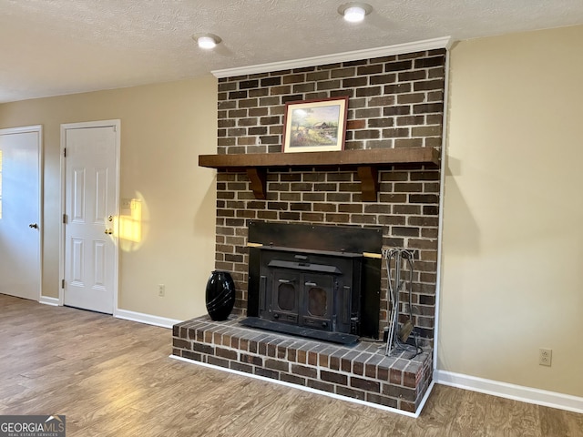 room details with hardwood / wood-style floors and a textured ceiling