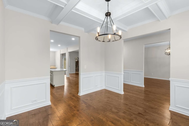 unfurnished dining area with dark hardwood / wood-style floors, coffered ceiling, beam ceiling, and a chandelier