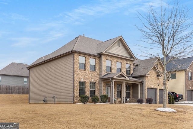 view of front facade featuring a garage and a front yard