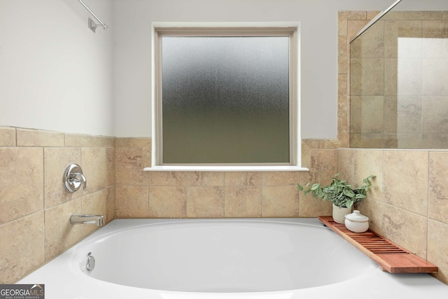 bathroom with a tub to relax in