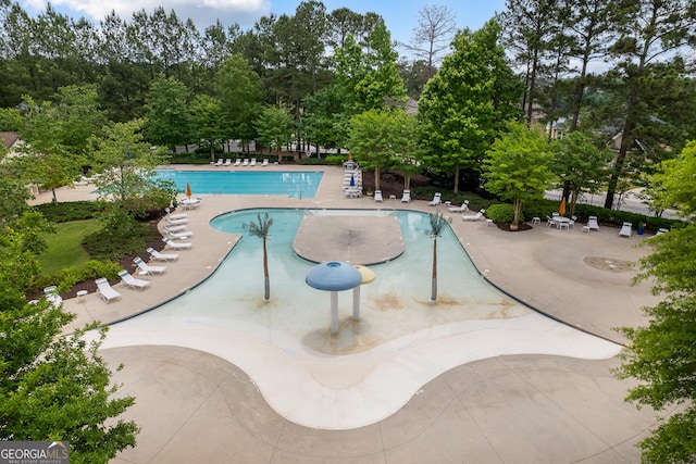 view of pool featuring a patio area