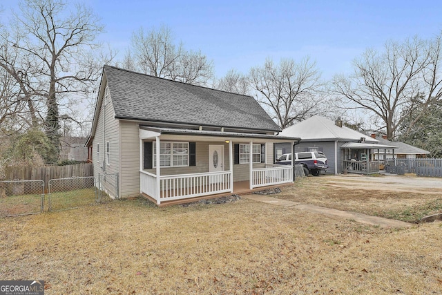 view of front of property with a front yard and a porch