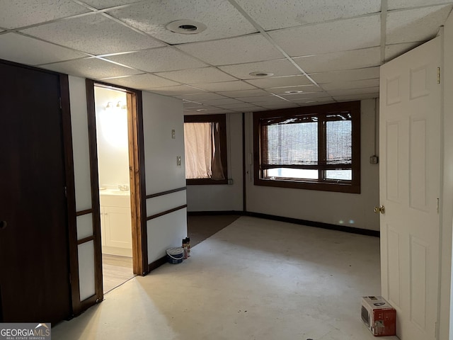 spare room featuring sink and a paneled ceiling