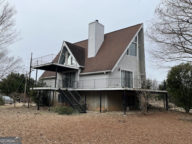 rear view of property with a deck