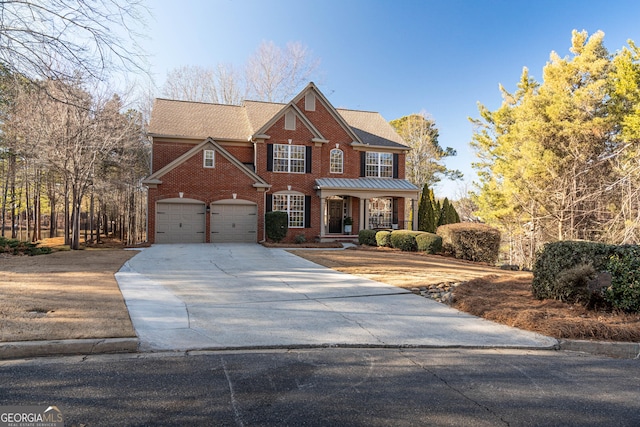 view of front of property featuring a garage and covered porch