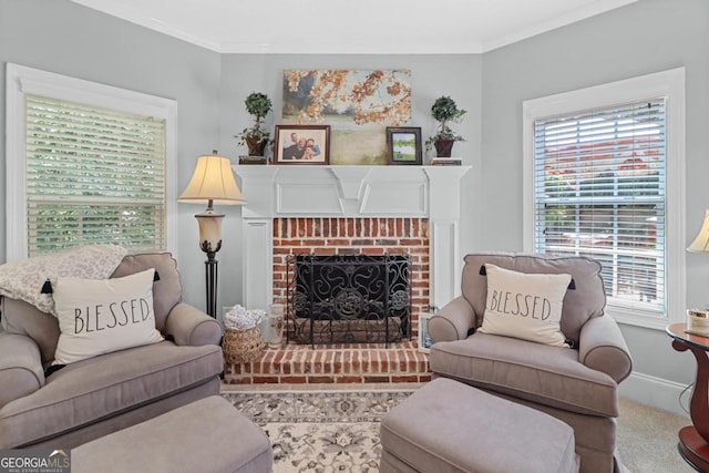 living room featuring crown molding, carpet flooring, and a fireplace