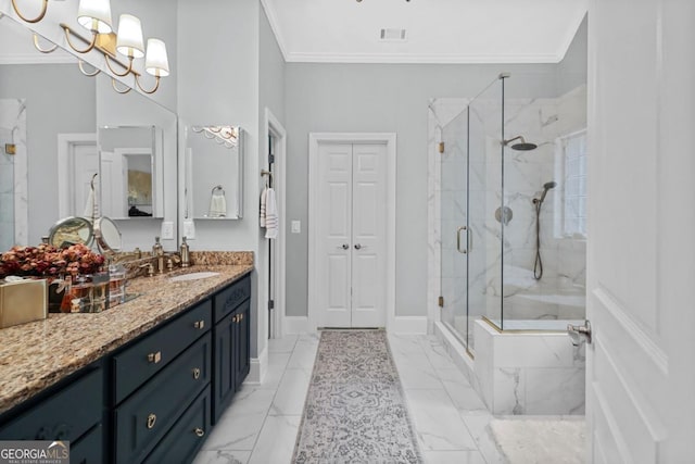 bathroom with vanity, a shower with door, ornamental molding, and a chandelier