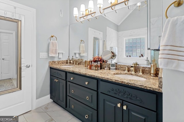 bathroom with lofted ceiling and vanity