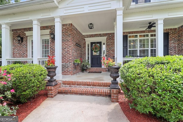 doorway to property featuring ceiling fan and a porch