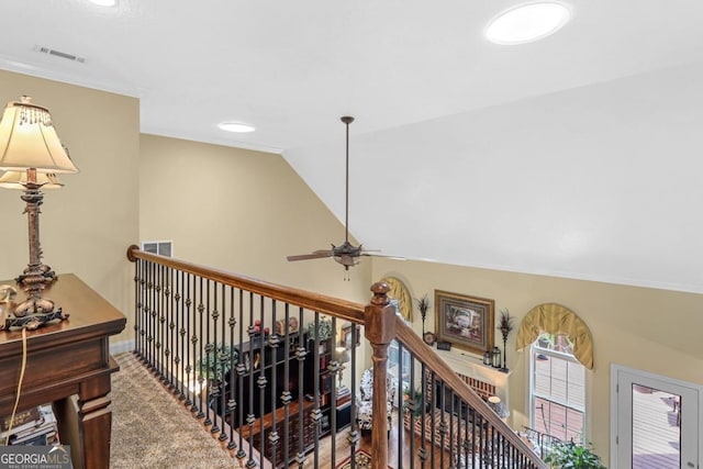 interior space with crown molding, lofted ceiling, and carpet floors