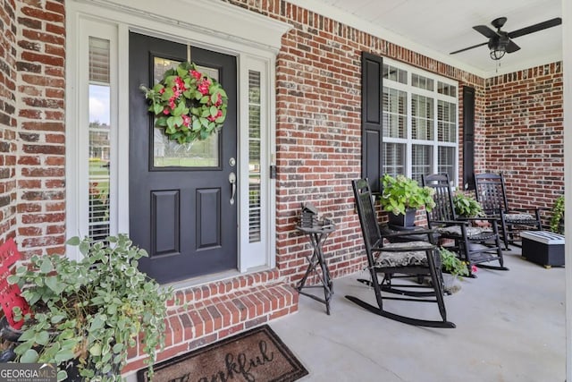 property entrance with covered porch and ceiling fan