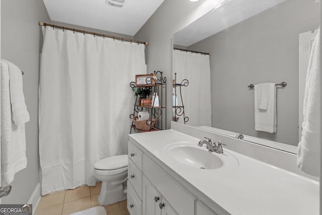 bathroom with vanity, tile patterned floors, and toilet