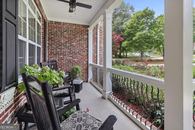 balcony featuring ceiling fan and a porch