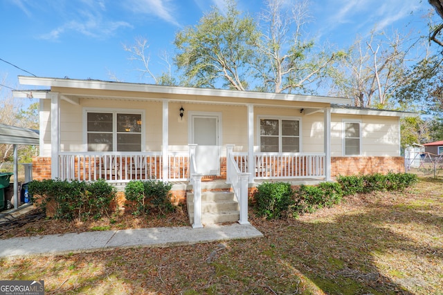 ranch-style house with covered porch