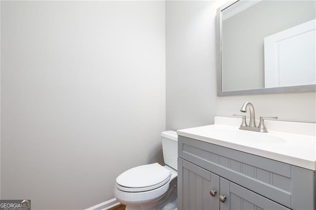 bathroom with vanity and toilet