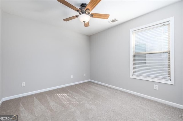 carpeted empty room with ceiling fan