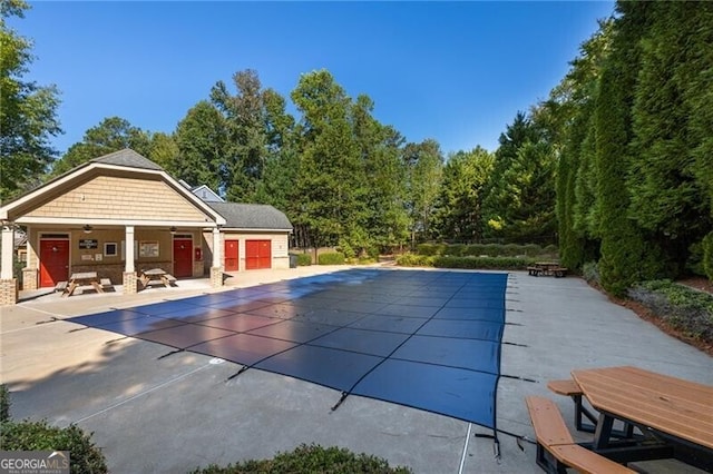 view of swimming pool featuring a patio