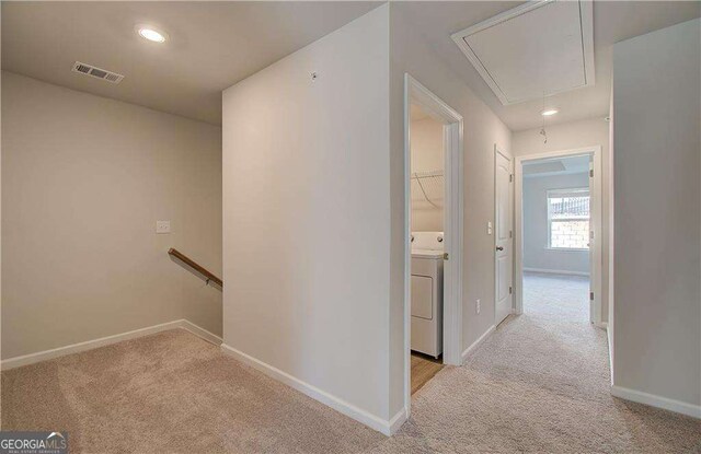 kitchen featuring white cabinetry, hanging light fixtures, stainless steel dishwasher, sink, and a center island with sink