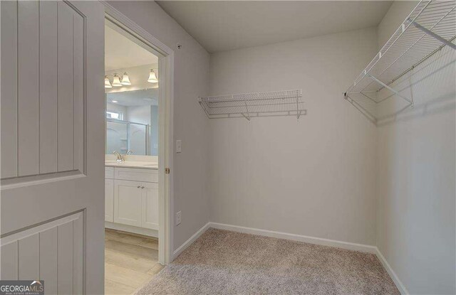 bathroom featuring hardwood / wood-style floors and an enclosed shower