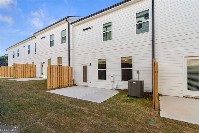 back of house with a patio, central AC unit, and a yard