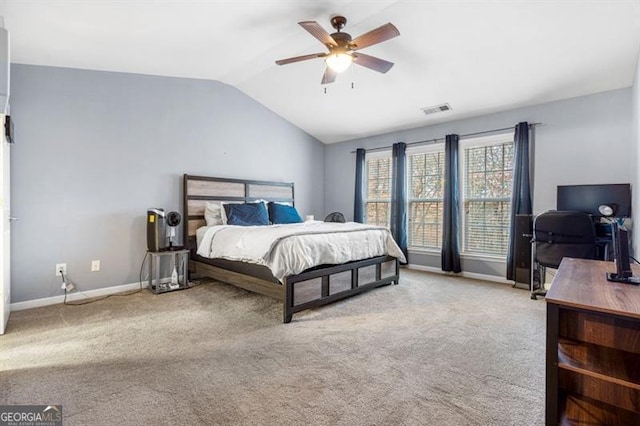 carpeted bedroom featuring ceiling fan, baseboards, visible vents, and vaulted ceiling