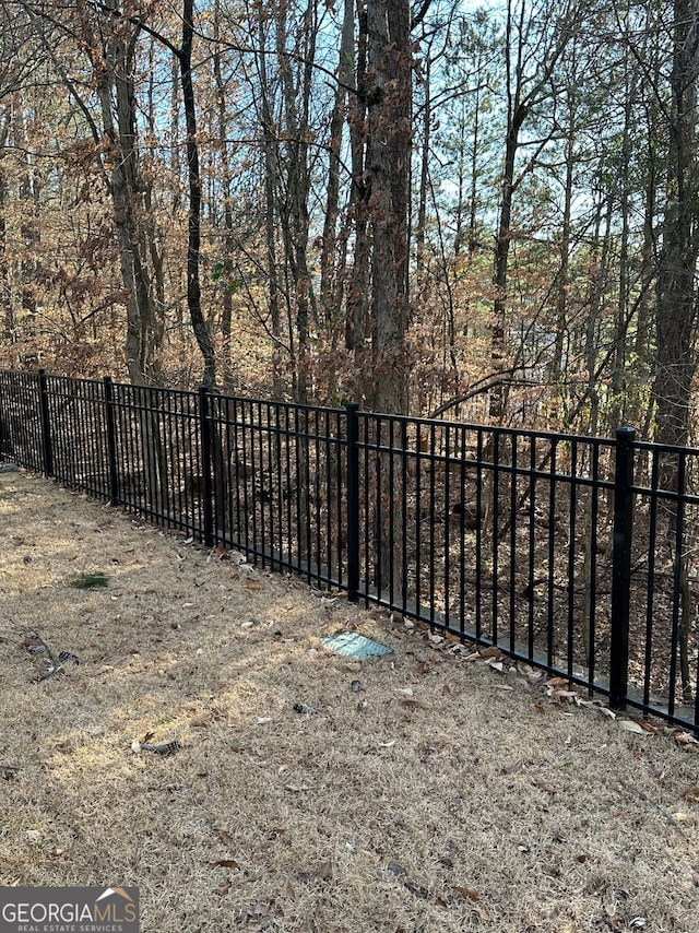 view of gate with fence