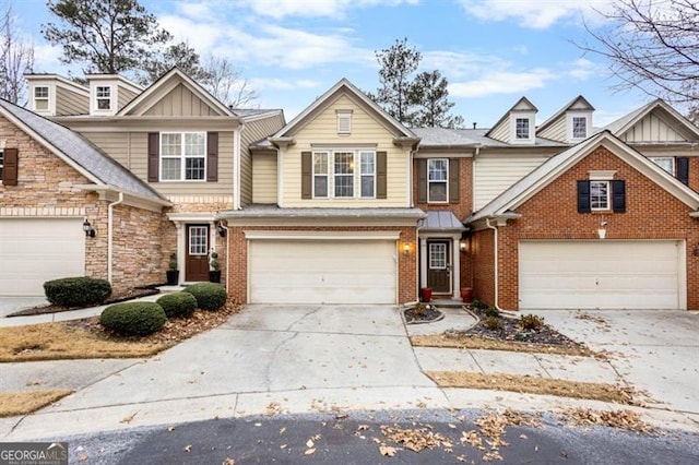 view of front of property featuring board and batten siding, brick siding, and driveway